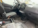 the interior of a truck with a seat and a console in it