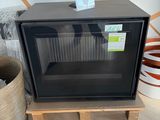 a black microwave sitting on a wooden stand in a room