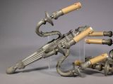two guns that are sitting next to each other on a table