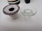 a small glass vase and a small glass vase on a table