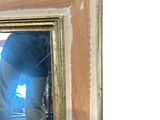 a man taking a picture of himself in a mirror