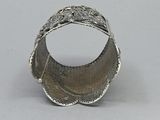 an image of a silver bracelet with a flower design on it