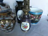 many vases that are sitting on a table
