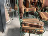 many chairs and chairs that are sitting in a room
