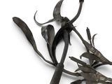 a close up of a metal object with scissors on it