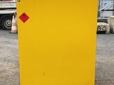 a close up of a yellow box with a red tag on it