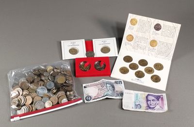 a lot of coins and a note on the table