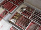 many silverware in a box on a table