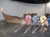 a wooden boat that is on display in a museum