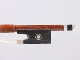 an image of a violin bow with a string attached to it