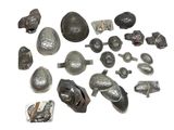 many different types of metal objects on a white surface