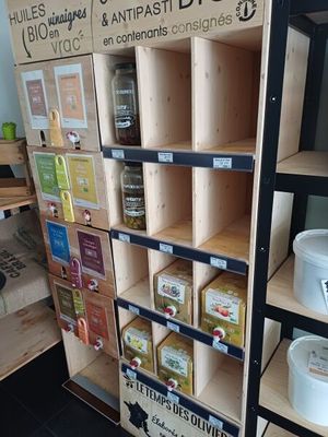 a wooden shelf with various items on it in a store