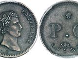 a silver coin with the face of a man on it