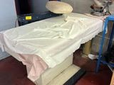 a table with a sheet on it in a room
