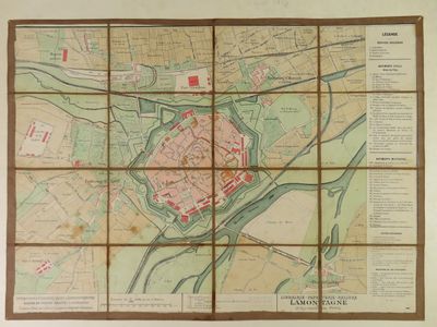 an old map of a city on a wall with a wooden frame