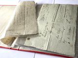 a book that has a lot of papers on top of it