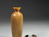 two vases sitting next to each other on a table
