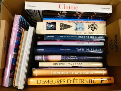 a box full of books that are stacked on top of each other