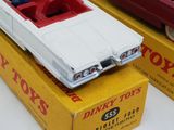 two toy cars that are on top of a box