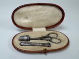 a pair of scissors in a case on a table