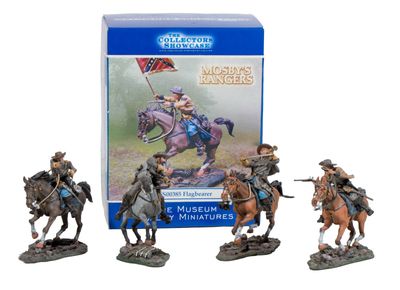 three figurines of men riding horses in front of a box