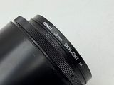 a close up of a camera lens on a white surface