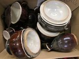 many bowls and cups in a cardboard box together