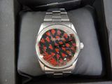 a watch that is sitting in a box on the table