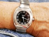 a person that is wearing a watch on their wrist