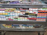 a cart full of books sitting on the ground