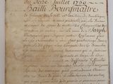 an old book with writing on it sitting on top of a table
