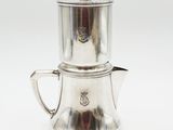 silver plated coffee pot and saucer