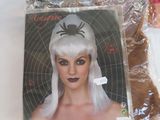 a picture of a woman with white hair and a white wig