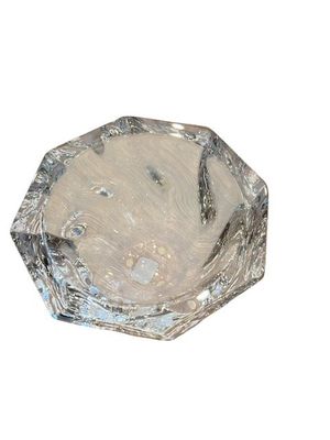 a glass bowl that has a silver design on it