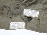 a close up of a military jacket with a label on it