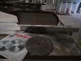 a book on a table with a circular saw on it