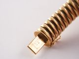 a close up of a gold colored pen with a gold colored tip