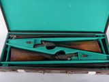 a green case with a pair of tools inside of it