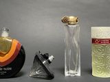three different types of perfume bottles on a table