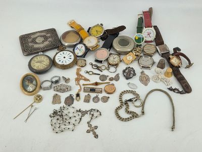 a lot of assorted watches and other items on the table