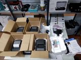 many boxes of cell phones sitting on a table