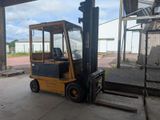 a forklift that is parked in a warehouse