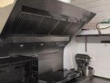 a kitchen with a stove, oven, and microwave in it