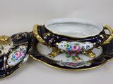 a bowl and saucer on a plate on a table