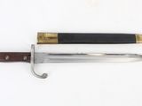 an image of a knife and a pen on a white surface