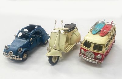 three toy cars that are sitting next to each other