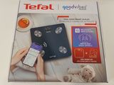 a box with a cell phone and a cell phone on it