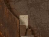 a close up of a piece of wood with a piece of fabric on it