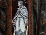 painting of a man in a white robe holding a cane in a wooden frame
