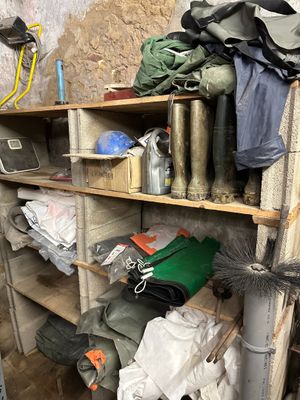 a shelf with many items on it in a room